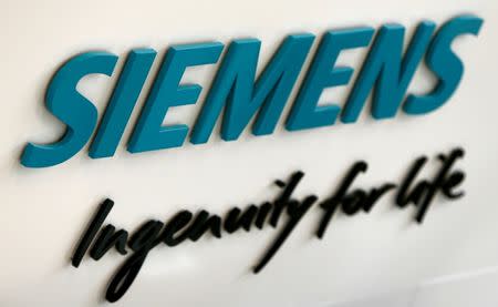 Siemens AG logo is seen in new headquarters in Munich, Germany, June 14, 2016. REUTERS/Michaela Rehle/File Photo