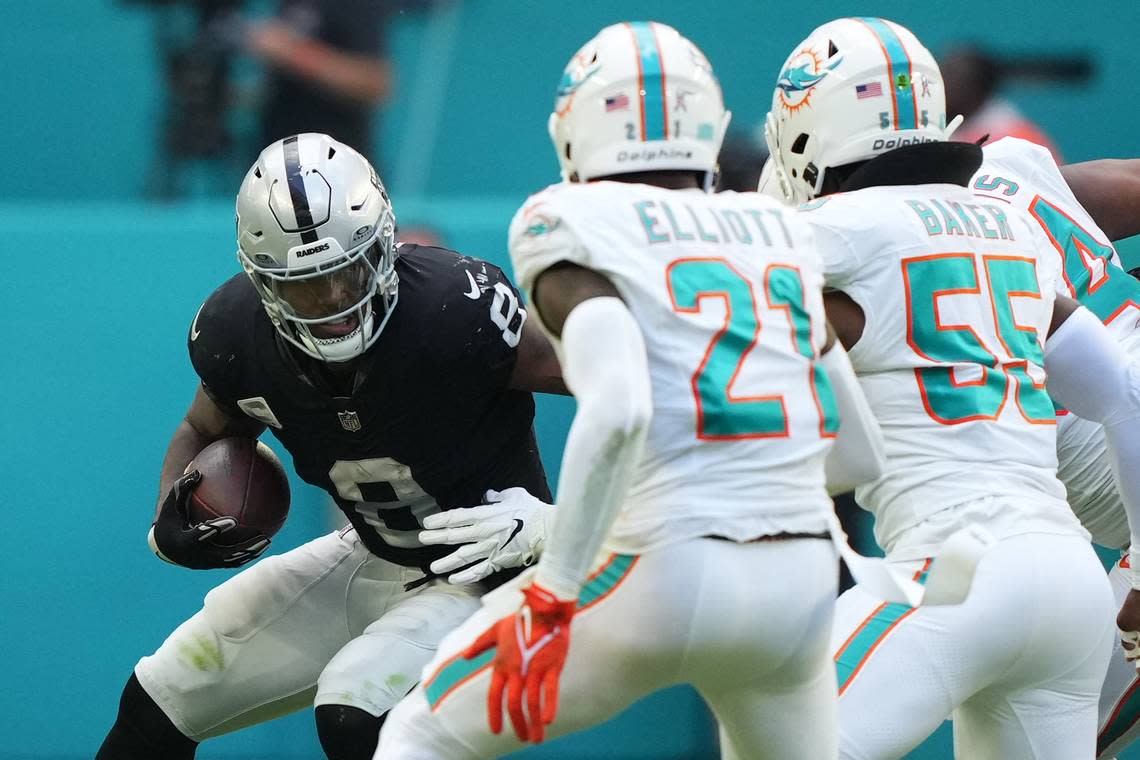Las Vegas Raiders running back Josh Jacobs (8) runs the ball against the Miami Dolphins during the second half at Hard Rock Stadium on Nov 19, 2023 at Miami Gardens, Florida.