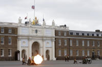 Soldiers of the Royal Horse Artillery fire a ceremonial gun during the 41 Death Gun salute in memory of Prince Philip at the Royal Artillery barracks in Woolwich, London, Saturday, April 10, 2021. Buckingham Palace officials announced Friday that Prince Philip, the husband of Queen Elizabeth II, has died . He was 99. (AP Photo/Alastair Grant, Pool)