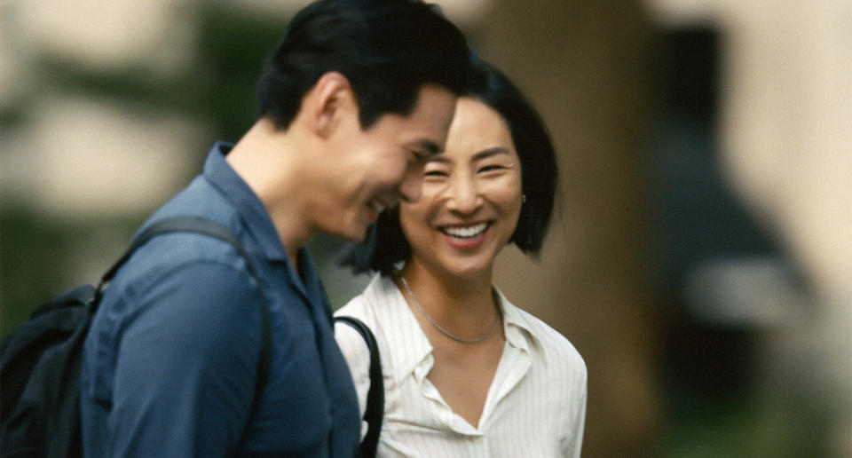 This image released by A24 shows Greta Lee, right, and Teo Yoo in a scene from "Past Lives." (Jon Pack/A24 via AP)