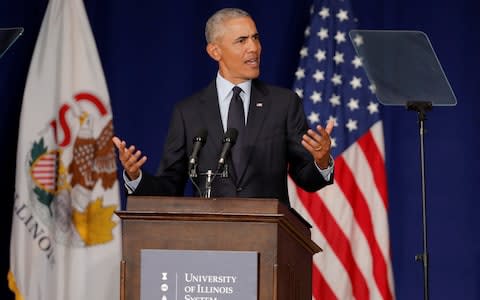 Barack Obama delivered a sharp rebuke to Donald Trump's presidency - Credit: Reuters