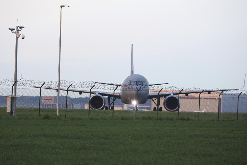 An Air Force Airbus carrying German citizens evacuated from Sudan lands at Berlin Brandenburg Airport in Schonefeld, Germany, Monday, April 24, 2023. (J'rg Carstensen/dpa via AP)