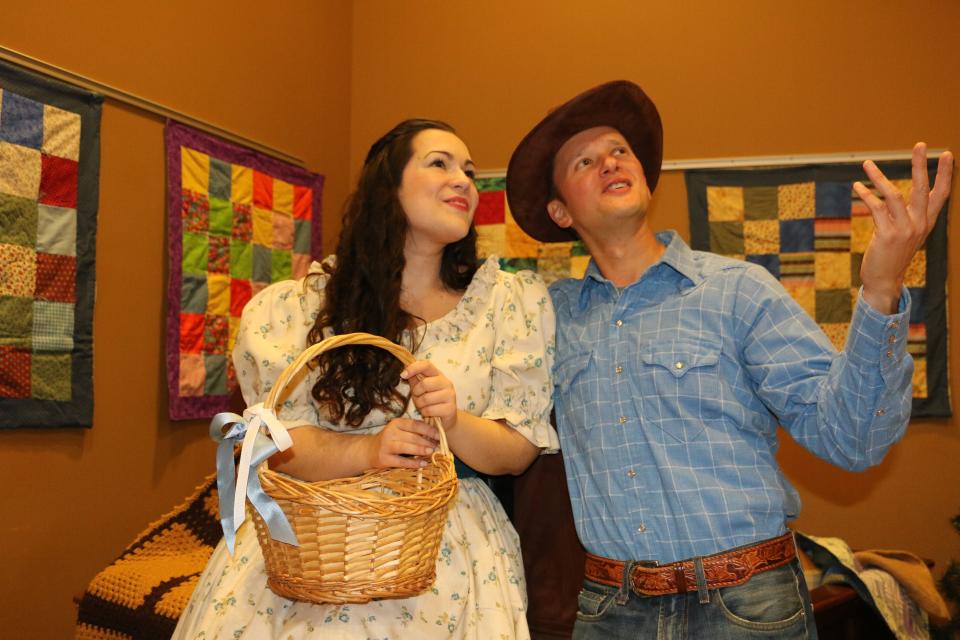Olivia Turpening, left, plays Laurey Williams, and Gary Kurnov plays the cowboy Curley in the new Manatee Players production of “Oklahoma!” by Richard Rodgers and Oscar Hammerstein II.
