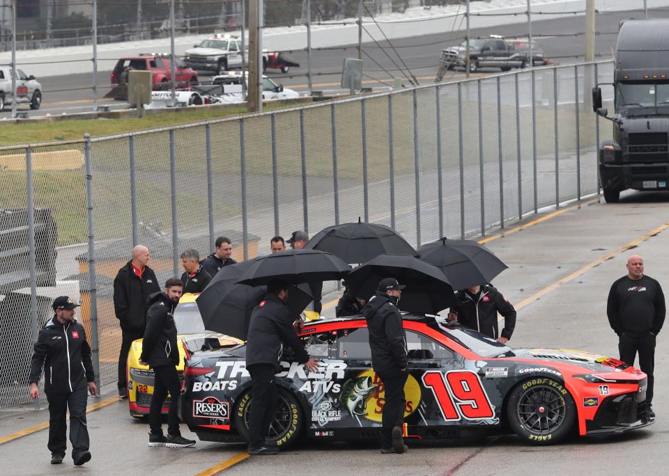 Cup teams wait in line for inspection as jet dryers work to dry the track as more rain threatens the United Rentals 300, Saturday morning, Feb. 17, 2024, at Daytona International Speedway.