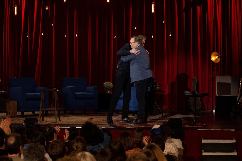 "Conan" sidekick Andy Richter, foreground, and host Conan O'Brien share an emotional hug during the June 24 finale of the TBS late-night talk show.