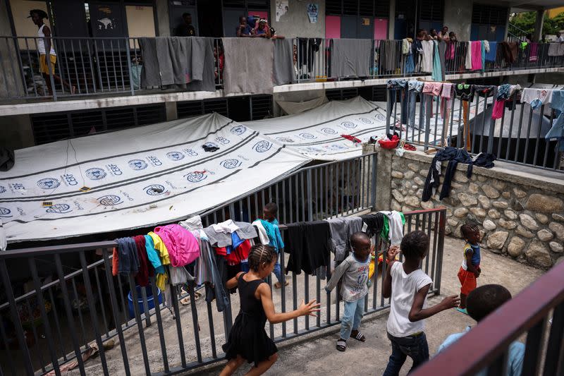 The Wider Image: Camping in schools, hungry Haiti families ask: when will normality return?