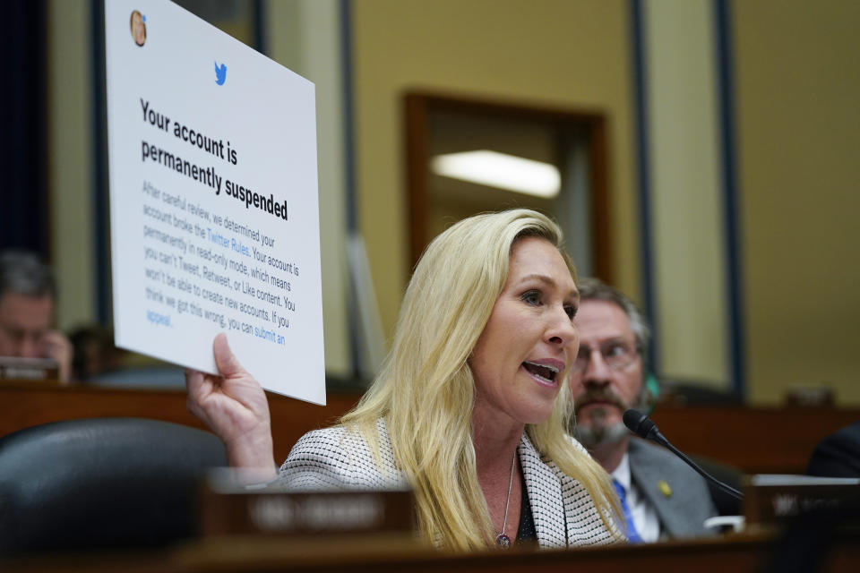 Rep. Marjorie Taylor Greene, R-Ga., holds up a tweet during a House Committee on Oversight and Accountability hearing titled "Protecting Speech from Government Interference and Social Media Bias, Part 1: Twitter's Role in Suppressing the Biden Laptop Story" on Capitol Hill, Wednesday, Feb. 8, 2023, in Washington. (AP Photo/Carolyn Kaster)