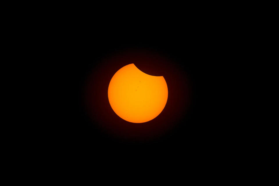 A partial view of the total solar eclipse is seen over Eugene, Ore., at 9:15 a.m. PDT on Monday, Aug. 21, 2017.