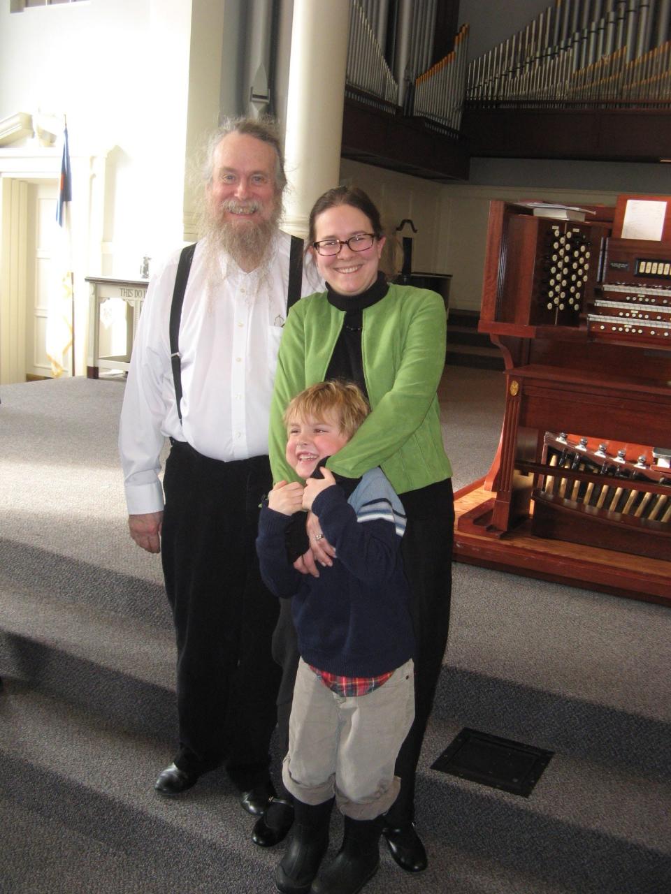 Rhonda Sider-Edgington poses with her son and Steve Jenkins at an American Guild of Organists concert at Harderwyck Ministries in Holland in 2014.