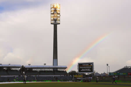 Cricket - Australia v England - Ashes test match - WACA Ground, Perth, Australia, December 17, 2017 - A rainbow can be seen above a screen announcing that play has been abandoned on the fourth day of the third Ashes cricket test match. REUTERS/David Gray