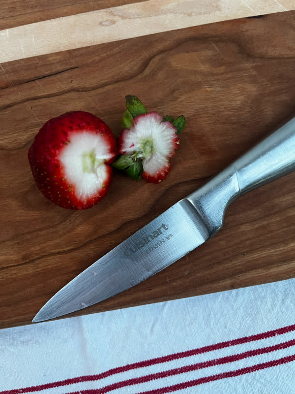 Slicing tops off with a paring knife<p>Courtesy of Jessica Wrubel</p>