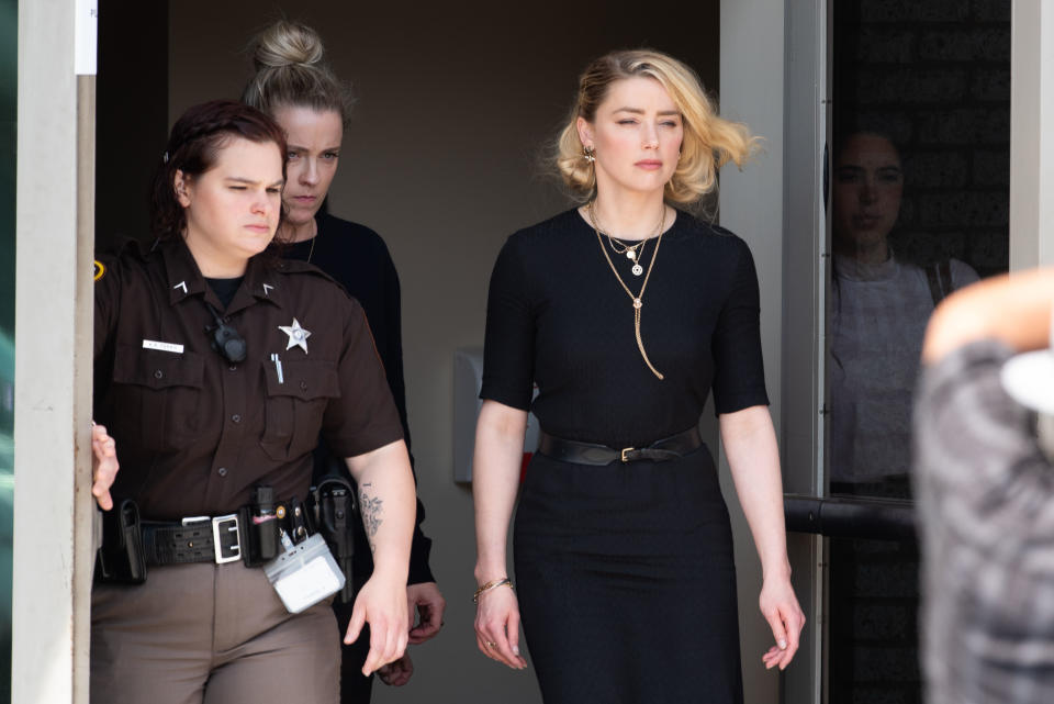 FAIRFAX, VA - JUNE 1: (NY & NJ NEWSPAPERS OUT) Amber Heard departs the Fairfax County Courthouse after the verdict announced_on June 1, 2022 in Fairfax, Virginia. The jury in the Johnny Depp vs. Amber Heard case awarded Depp $15 million in damages to his career over an op-ed Heard wrote in the Washington Post in 2018.(Photo by Cliff Owen/Consolidated News Pictures/Getty Images)