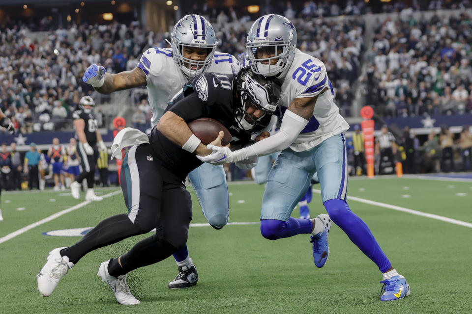 ARLINGTON, TX - DECEMBER 24: Philadelphia Eagles quarterback Gardner Minshew (10) is tackled by Dallas Cowboys linebacker Micah Parsons (11) and cornerback Nahshon Wright (25) during the game between the Dallas Cowboys and the Philadelphia Eagles on December 24, 2022 at AT&T Stadium in Arlington, Texas. (Photo by Matthew Pearce/Icon Sportswire via Getty Images)