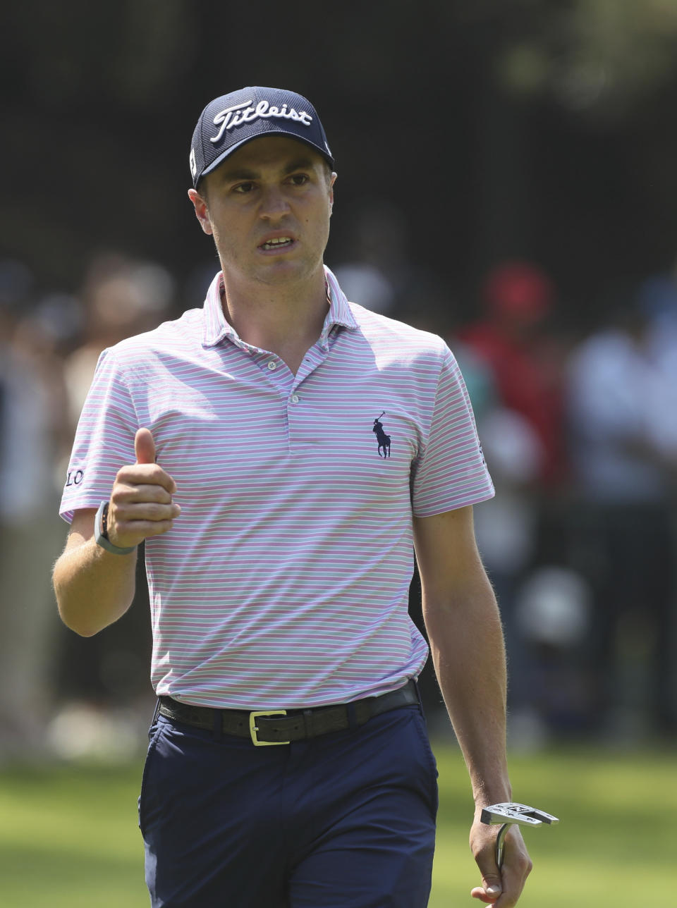 Justin Thomas of United States gestures after a putt at the fourth green during the final round for the WGC-Mexico Championship golf tournament, at the Chapultepec Golf Club in Mexico City, Sunday, Feb. 23, 2020.(AP Photo/Fernando Llano)