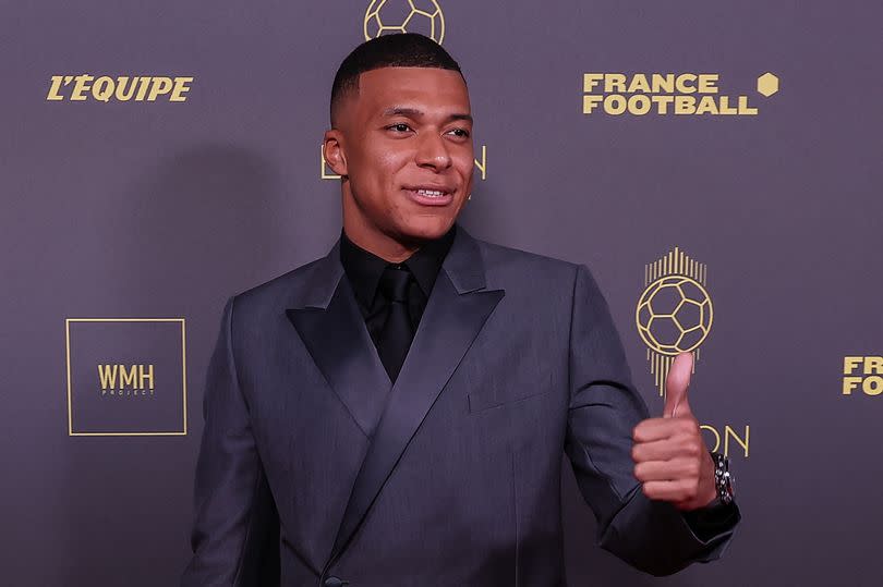 Kylian Mbappe gestures a thumbs-up