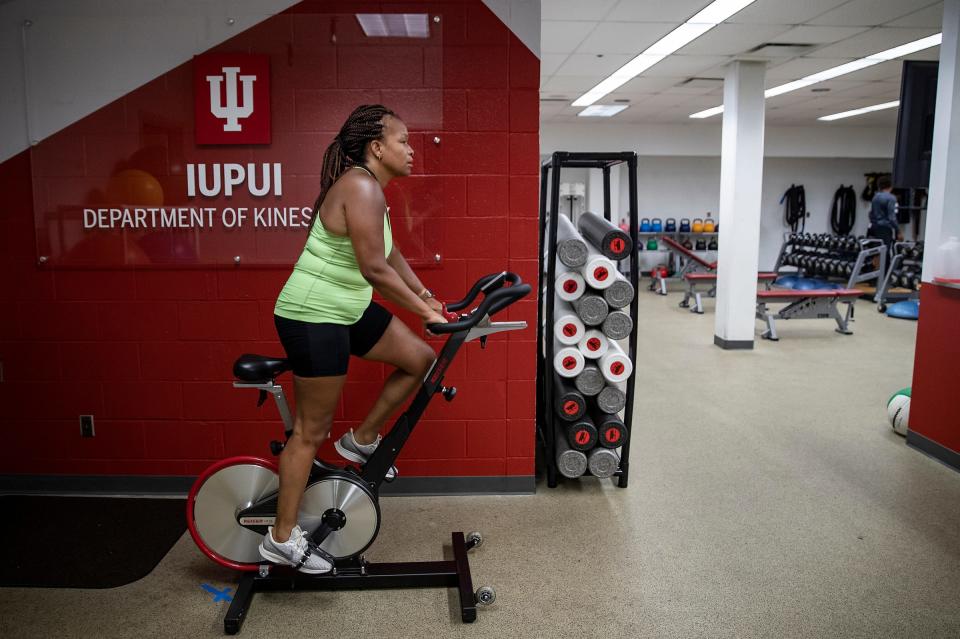 NiCole Keith, president of the American College of Sports Medicine, rides a stationary bike during a workout July 13 in Indianapolis.