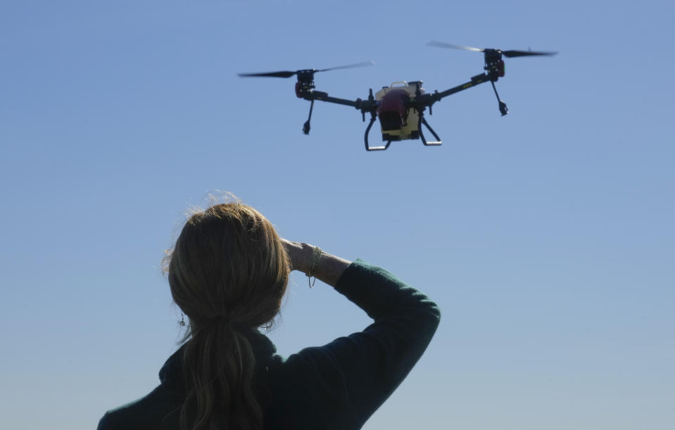 USAID Administrator Samantha Power observes drones which were received by local farmers from the USAID on the outskirts of Kyiv, Ukraine, Thursday, Oct. 6, 2022. The U.S. deployed its international development chief to Ukraine on Thursday, the highest-ranking American official to visit the country since Russia illegally annexed the four regions. (AP Photo/Efrem Lukatsky, Pool)