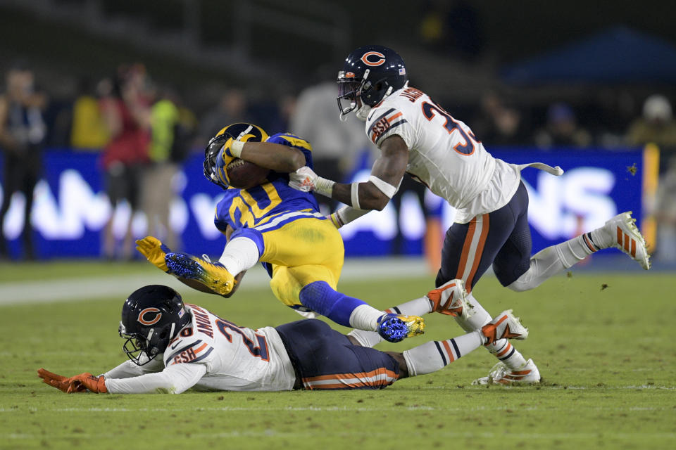 Los Angeles Rams running back Todd Gurley, middle, is tackled by Chicago Bears cornerback Prince Amukamara, bottom, and free safety Eddie Jackson during the second half of an NFL football game Sunday, Nov. 17, 2019, in Los Angeles. (AP Photo/Kyusung Gong)