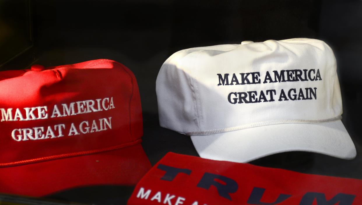 T-shirts and hats with Donald Trump’s presidential campaign slogan, “Make America Great Again.” (Photo: Robert Alexander/Getty Images)