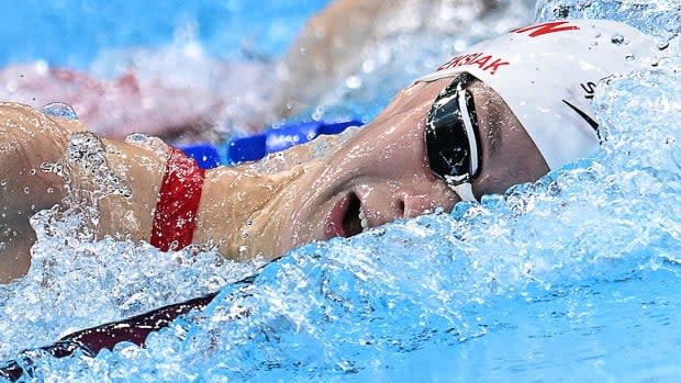 Canada's Penny Oleksiak came on strong late in her Olympic 100-metre freestyle heat, posting a time of 52.95 seconds to qualify sixth for Wednesday's semifinals at 9:53 p.m. ET in Tokyo. The 21-year-old from Toronto is looking to defend her title. (Jonathan Nackstrand/AFP via Getty Images - image credit)