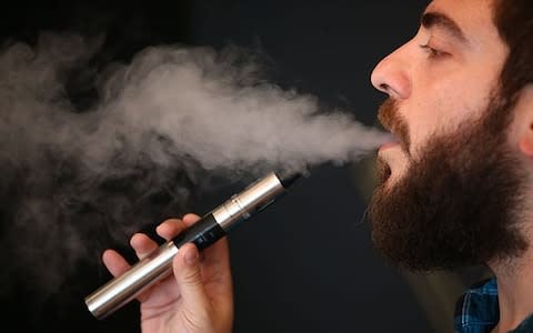 Many smokers have switched to e-cigarettes but experts warn that they should only be used as a quitting aid in the short term - Credit: Dan Kitwood