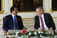 Czech Republic's President Millos Zeman, right, welcomes Qatari Emir Sheikh Tamim Bin Hamad Al-Thani at the Prague Castle in Prague, Czech Republic, Wednesday, Oct. 5, 2022. (AP Photo/Petr David Josek)