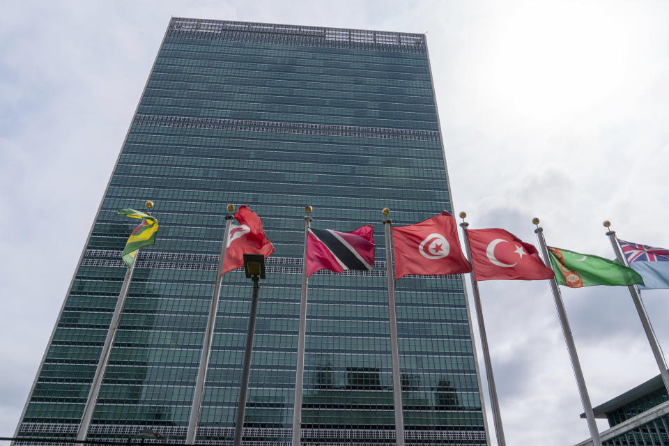 Member state flags fly outside the United Nations headquarters, Friday, Sept. 18, 2020, in New York. With the COVID-19 pandemic still circling the globe, world leaders are skipping their annual gathering in New York and will make pre-recorded speeches this week on the state of a deeply divided world turned topsy-turvy. (AP Photo/Mary Altaffer)