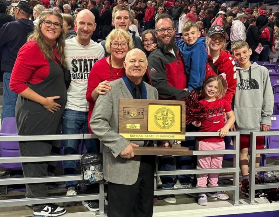 Moundridge boys basketball coach Vance Unrau celebrates his sixth and final state championship with his family. He is retiring after 36 years at the school.