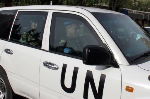 Members of a UN monitoring team, tasked with monitoring the UN-backed ceasefire in Syria, arrive at a hotel in Damascus. Syria sought on Wednesday to reassure the United Nations over its willingness to implement a ceasefire despite violence and casualties still reported in various parts of the country