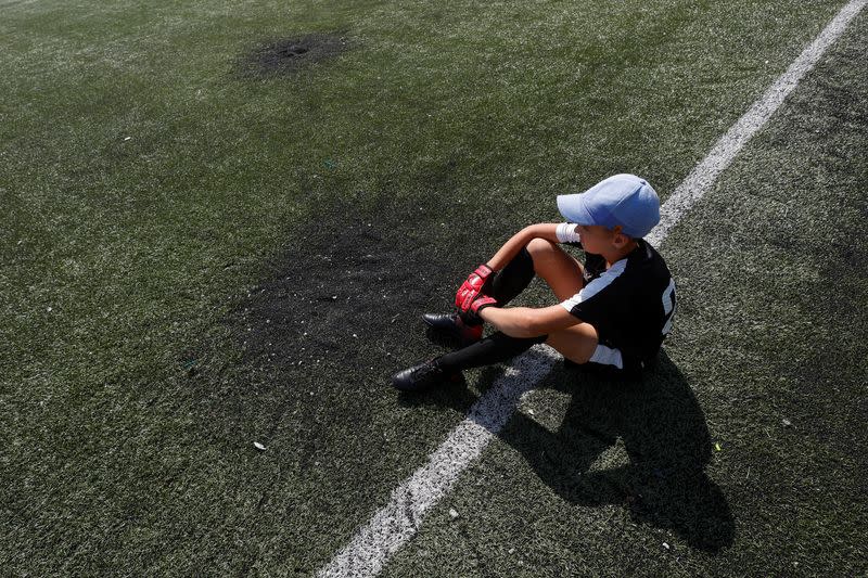 Young players of the Olymp football club attend a training session at the Central stadium in the town of Irpin