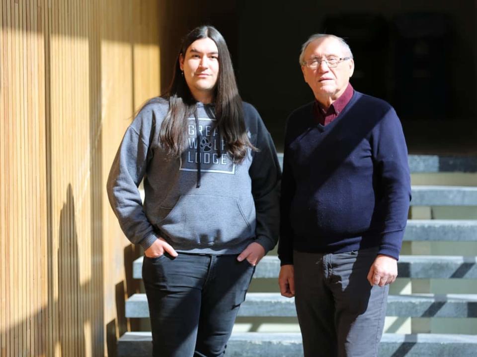 Samuel Robinson, left, a second-year student at the University of Manitoba, is the only student this term in an intermediate Cree class taught by Ken Paupanekis, right. (Tyson Koschik/CBC - image credit)