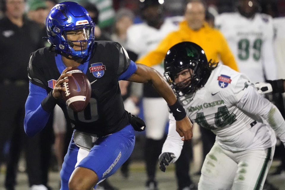 Boise State quarterback Taylen Green (10) runs from North Texas linebacker Mazin Richards (44) during the first quarter of the Frisco Bowl NCAA college football game Saturday, Dec. 17, 2022, in Frisco, Texas. (AP Photo/LM Otero)