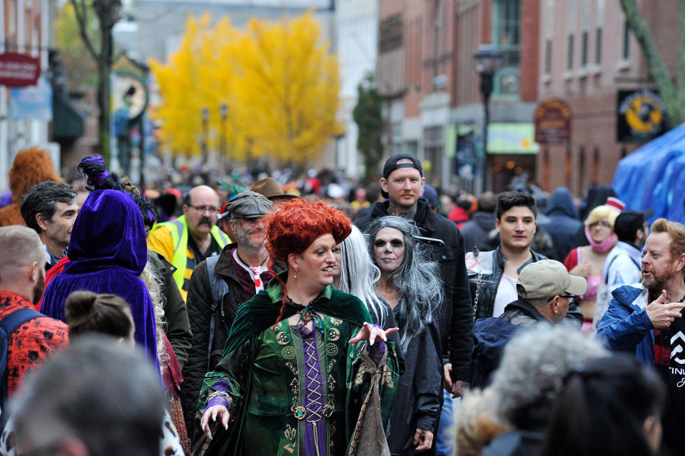 Revellers walk through the streets during Halloween on in Salem, MA. (Joseph Prezioso / AFP via Getty Images)