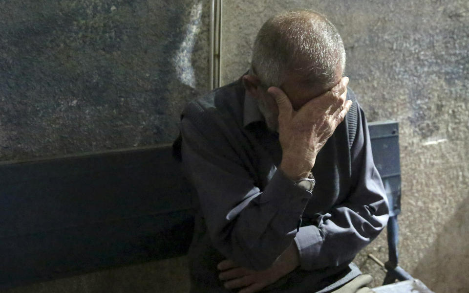 A relative reacts after he saw the bodies of two Hamas militants, who where killed during an Israeli airstrike at Hamas militants post central Gaza Strip, out side the morgue of Al-Aqsa hospital in Deir el-Balah, central Gaza Strip, Friday, May 3, 2019. Three Palestinians, including two militants, were killed by Israeli fire Friday after gunshots from the Gaza Strip wounded two Israeli soldiers, officials said. (AP Photo/Adel Hana)