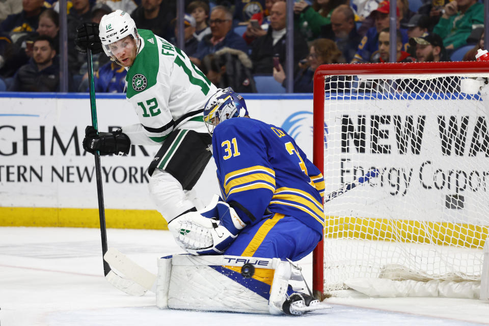 Dallas Stars center Radek Faksa (12) is stopped by Buffalo Sabres goaltender Eric Comrie (31) during the second period of an NHL hockey game Thursday, March 9, 2023, in Buffalo, N.Y. (AP Photo/Jeffrey T. Barnes)