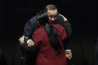 Guatemala's President Alejandro Giammattei is embraced by Mexican Senate President Monica Fernandez Balboa after he addressed lawmakers in Mexico City, Thursday, Feb. 6, 2020. (AP Photo/Rebecca Blackwell)