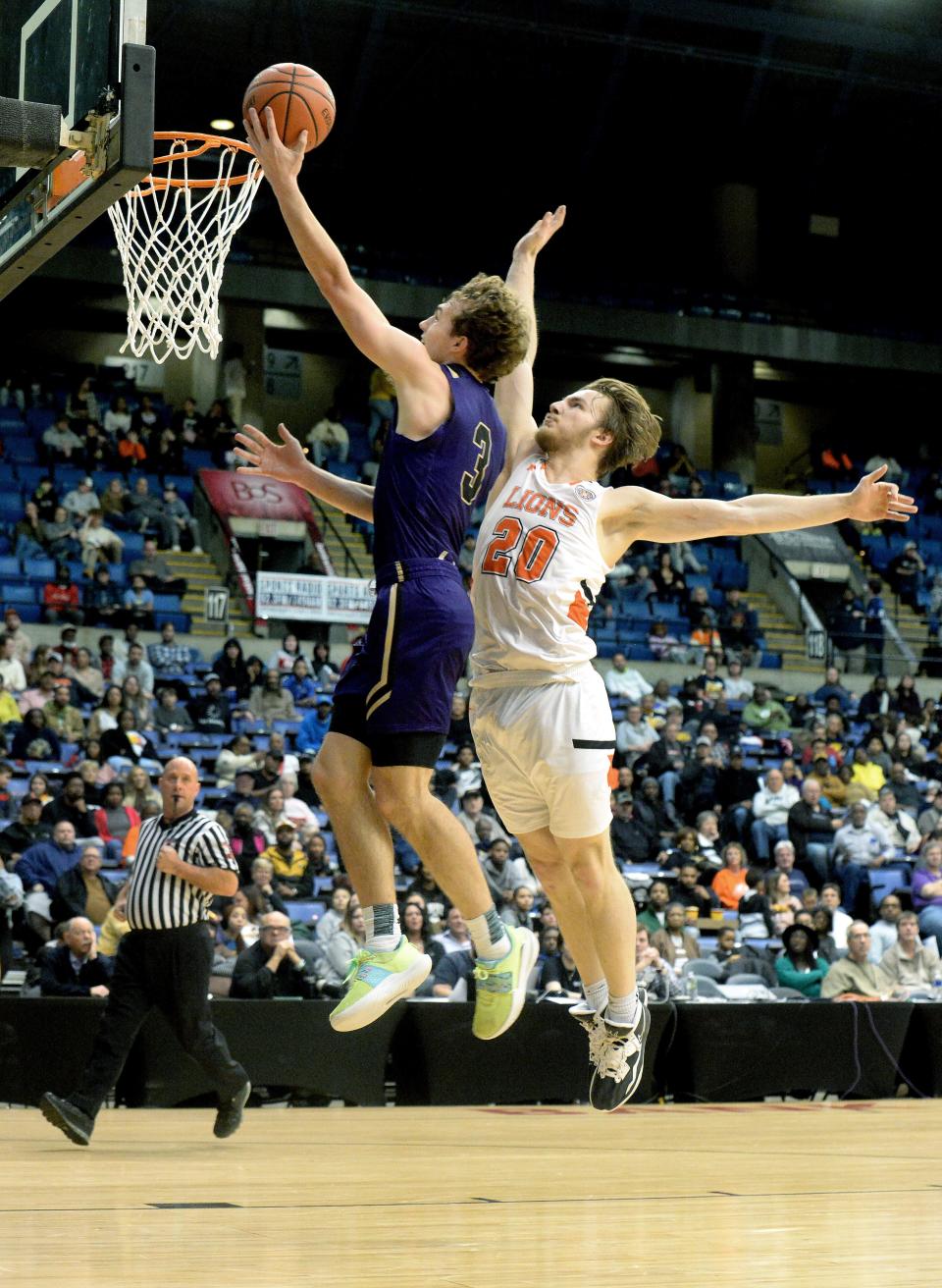 Sacred Heart-Griffin's Jake Hamilton goes up for a shot as he is being guarded by Lanphier High School's Austin Robinson during the boys championship game at the City Tournament Saturday Jan. 28, 2023.