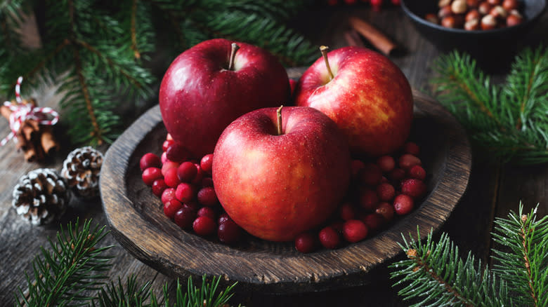 apples and cranberries with pine