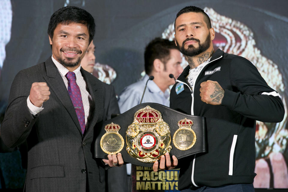 Manny Pacquiao, left, poses with Argentine WBA welterweight champion Lucas Matthysse on Thursday. (AP)