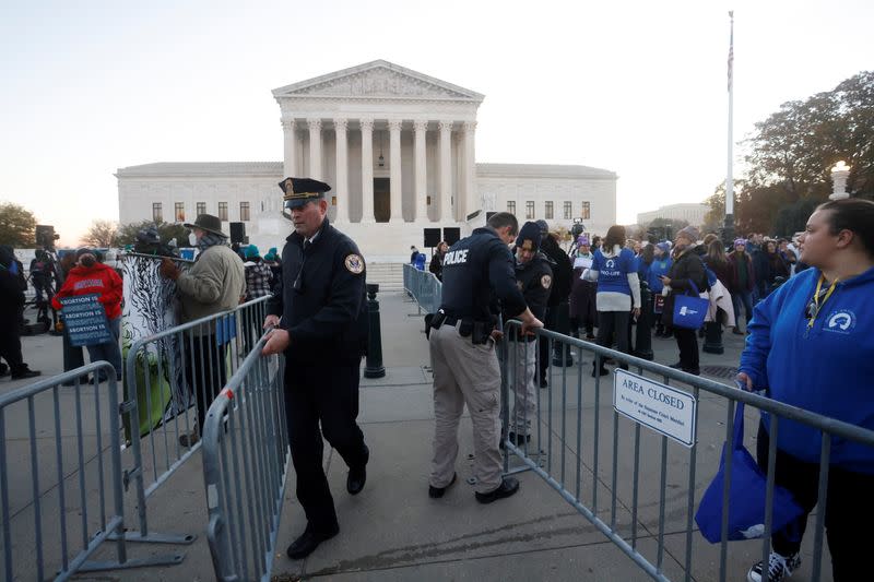 Anti-abortion and pro-abortion rights protesters gather outside Supreme Court in Washington