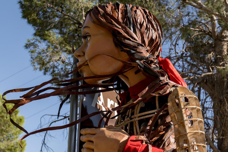 Little Amal, the 12-foot puppet of a ten-year-old Syrian child, makes her way to her first stop in El Paso at Armijo Park in Segundo Barrio from Aoy Elementary School on Wednesday, Oct. 25, 2023.