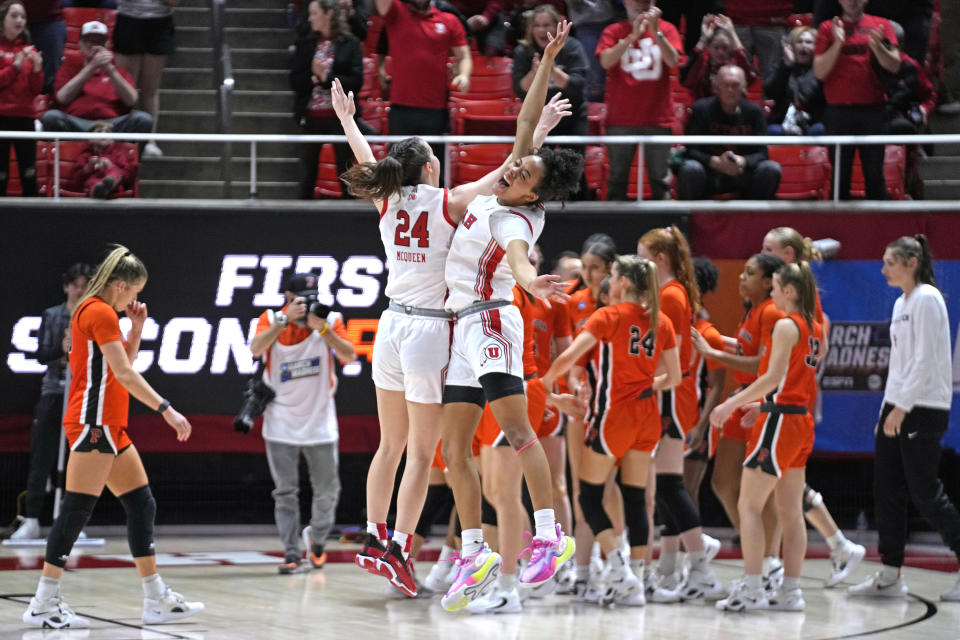 Utah's Kennady McQueen (24) and Lani White, right, celebrate following the team's win over Princeton in a second-round college basketball game in the women's NCAA Tournament, Sunday, March 19, 2023, in Salt Lake City. (AP Photo/Rick Bowmer)