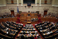 Former Greek Prime Minister Antonis Samaras addresses lawmakers during a parliamentary session before a vote on setting up a special committee which will probe the role of ten politicians in a case which involves alleged bribery by Swiss drugmaker Novartis, in Athens, Greece, February 21, 2018. REUTERS/Alkis Konstantinidis