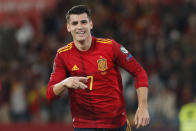 Spain's Alvaro Morata celebrates after scoring the opening goal during the World Cup 2022 group B qualifying soccer match between Spain and Sweden at La Cartuja stadium in Seville, Spain, Sunday, Nov. 14, 2021. (AP Photo/Angel Fernandez)