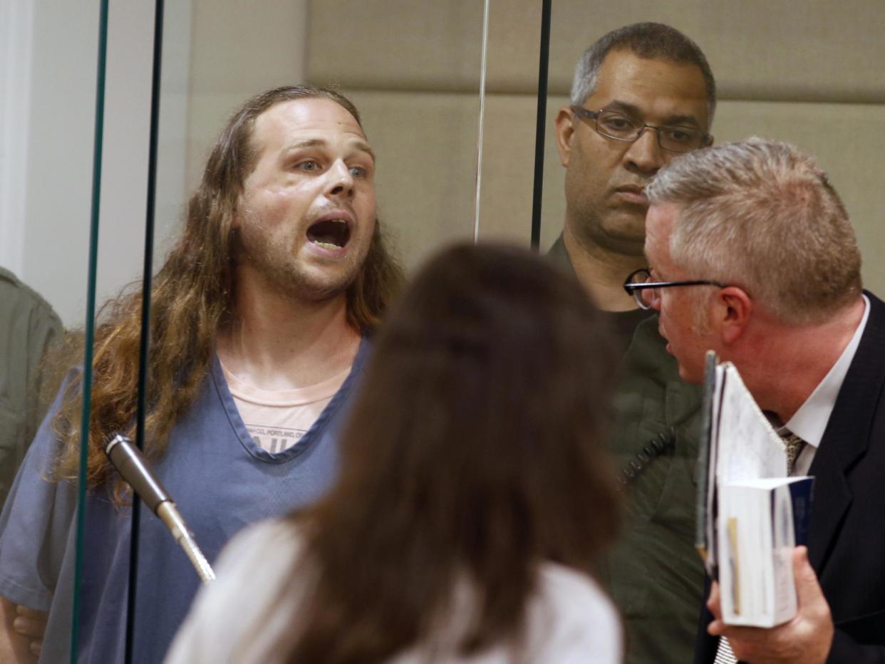 Jeremy Joseph Christian shouts as he is arraigned in Multnomah County Circuit Court in Portland: Beth Nakamura/The Oregonian/AP