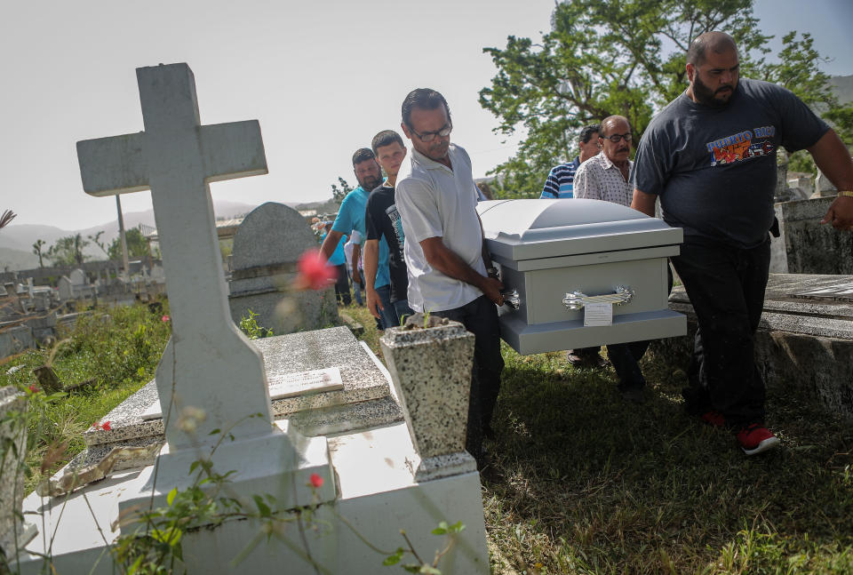 Mourners in Utuado, Puerto Rico, carry the casket of Wilfredo Torres Rivera, 58, who killed himself three weeks after Hurricane Maria. His family said he suffered from depression and schizophrenia and was caring for his 92-year-old mother in a home without electricity or water in the aftermath of the storm. (Photo: Mario Tama via Getty Images)