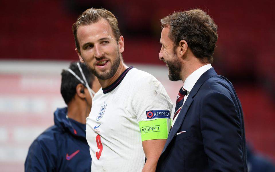 Harry Kane of England and Gareth Southgate, Manager of England speak following  - Getty Images