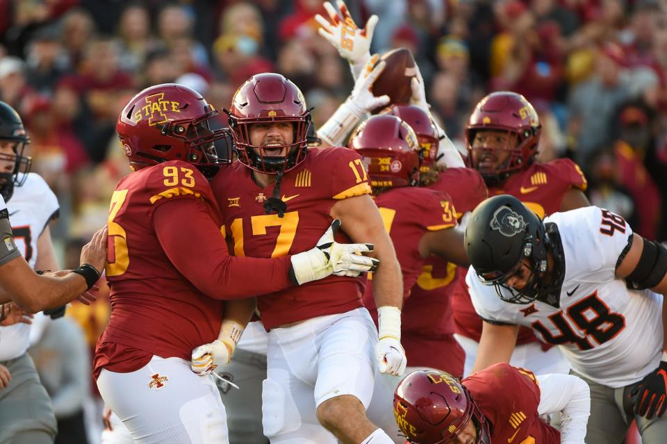 Iowa State defensive back Beau Freyler (17) and defensive tackle Isaiah Lee (93) celebrate during the Cyclones' win over Oklahoma State. Freyler and Lee are two of the young players Campbell highlighted.
