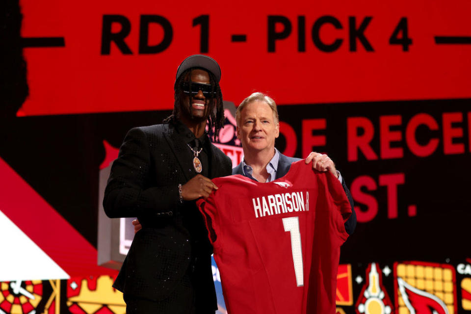 Marvin Harrison Jr. poses with NFL Commissioner Roger Goodell after being selected fourth overall by the Arizona Cardinals during the first round of the 2024 NFL Draft at Campus Martius Park and Hart Plaza on April 25, 2024 in Detroit, Michigan. / Credit: Getty Images