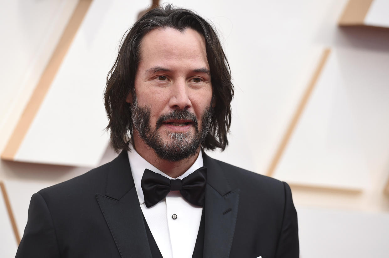 Keanu Reeves arrives at the Oscars on Sunday, Feb. 9, 2020, at the Dolby Theatre in Los Angeles. (Photo by Jordan Strauss/Invision/AP)